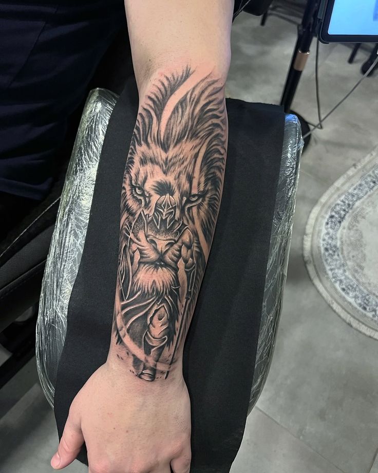 Spartan warrior with lion forearm tattoo